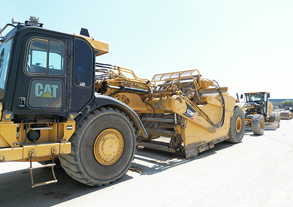 Image of yellow earthwork scraper