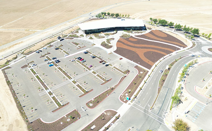 Image of the completed extension project at Valley Childrens Hospital. Parking lot and building shown.